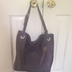 Dooney medium grommet sac leather hobo bag.